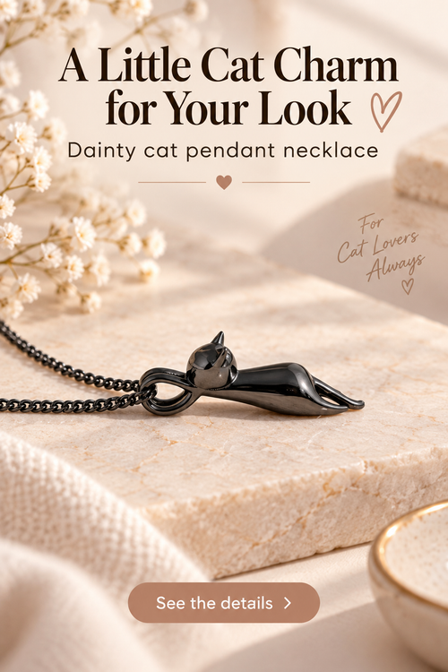 Gunmetal cat pendant necklace on cream marble with headline A Little Cat Charm for Your Look.