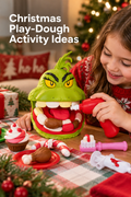 A child in a red Christmas sweater plays at a holiday table with a green Grinch face Play-Doh playset, using a red tool beside molded pretend cupcakes, candy canes, drumsticks, and colorful compound pieces. Wrapped gifts, evergreen garland, red ornaments, and a softly lit Christmas tree create a cozy festive background. The vertical lifestyle image has the white headline “Christmas Play-Dough Activity Ideas” in the upper left. A toothbrush tool rests on the plaid tabletop.