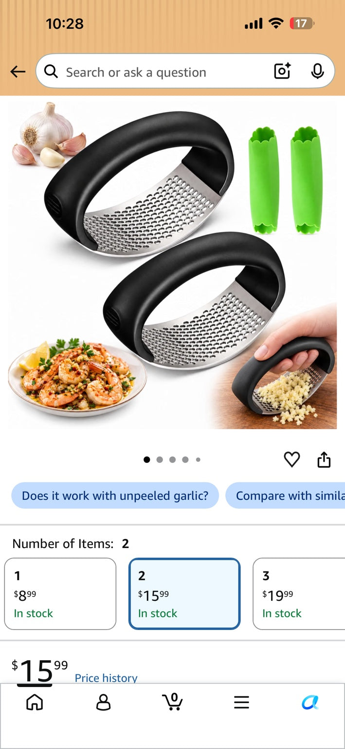 Two curved stainless steel garlic rockers with black handles and two green silicone peelers.