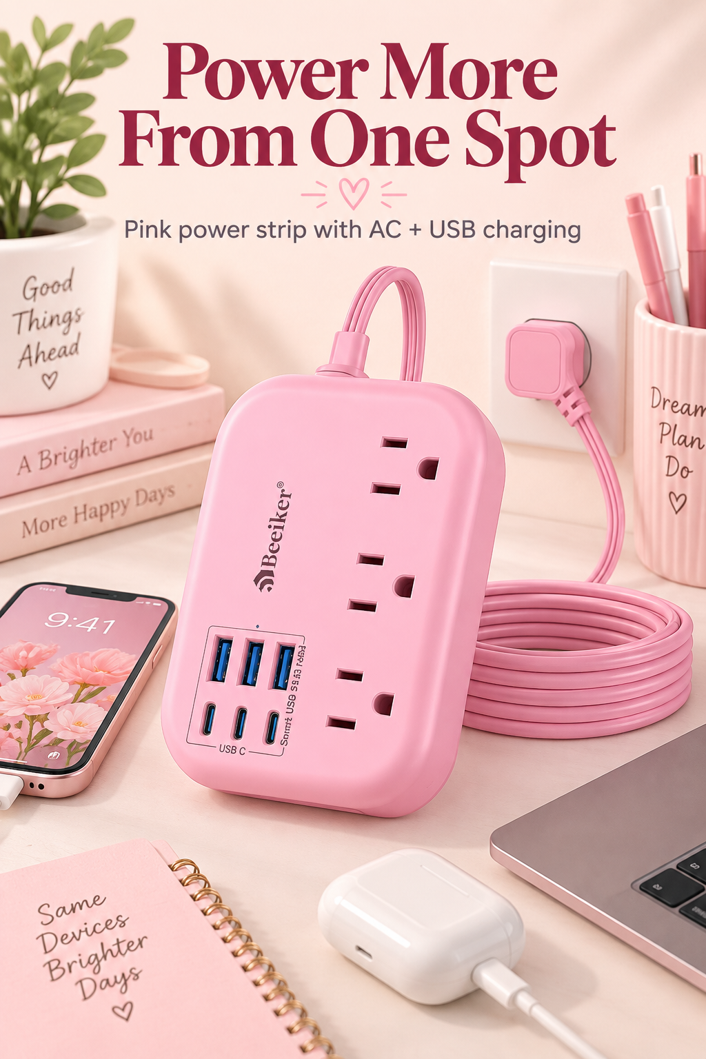 Pink power strip on a tidy desk with the headline Power More From One Spot.