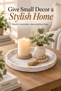 Distressed white round wooden decorative tray styled on a coffee table with the headline Give Small Decor a Stylish Home.