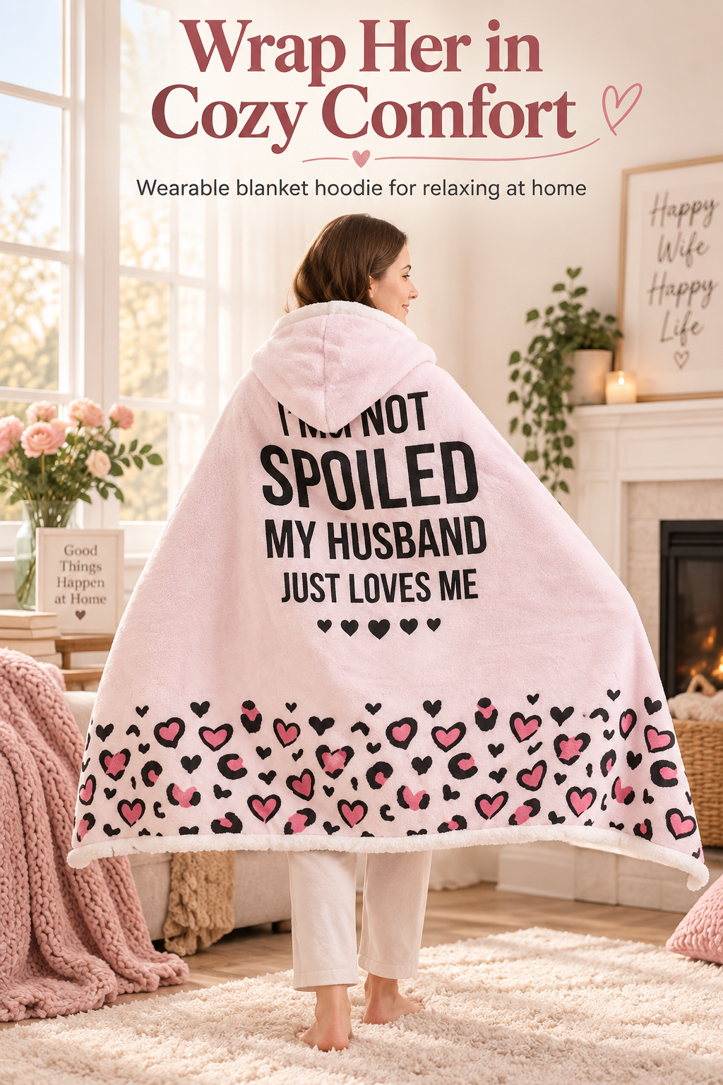 Pink wearable blanket hoodie shown in a cozy home setting with the headline “Wrap Her in Cozy Comfort.”