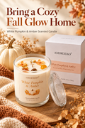 White pumpkin and amber scented candle in a warm fall setting with pumpkins and dried flowers, with the headline Bring a Cozy Fall Glow Home.